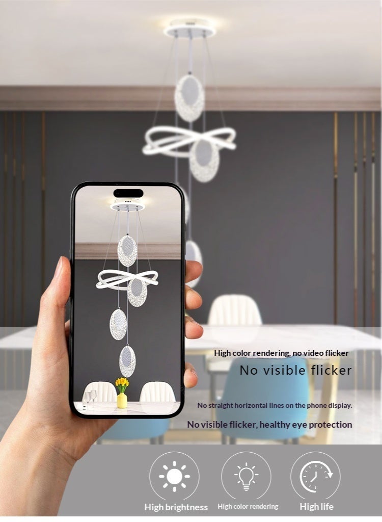 An LED pendant light with 4 oval lamp heads, featuring three different lighting colors that can be adjusted. It can be controlled via remote control or switch. The height is adjustable. Suitable for above the dining table, bedroom, and living room. Adjustable, suitable for the dining area. - Image 4